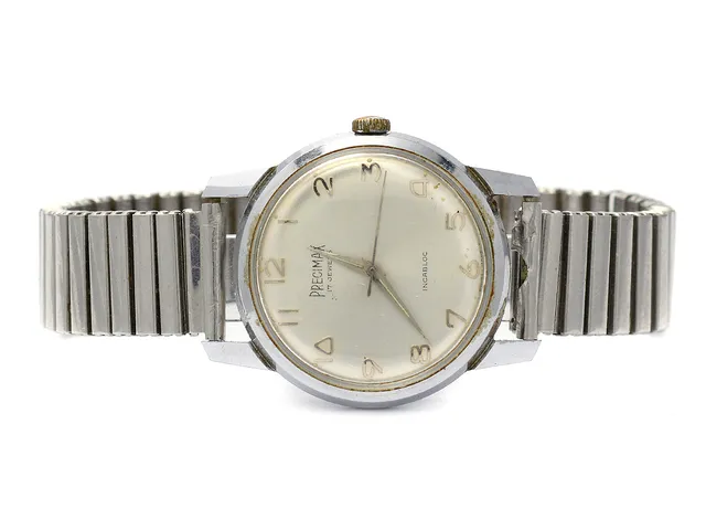 PRECIMAX, herrur, 34,5 mm, Cal ST 1686, Boett nr. 8333, vitmetall, manuell, plexiglas, skadad urtavla, ca 1960, metallänk ej original.