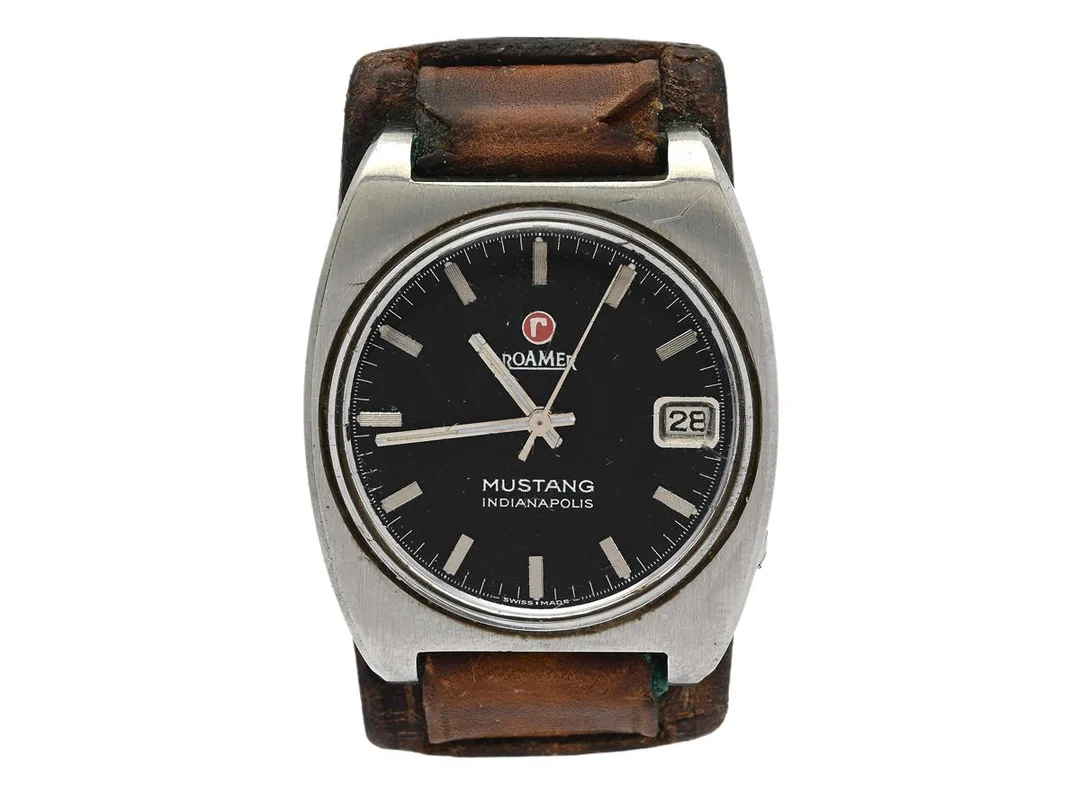 ROAMER, Mustang, Indianapolis, Cal 471, Boett nr. 471-1120.601, herrur, 35 mm, stål, manuell, plexiglas, datum, läderband, ca 1970. — Klockor/Roamer — Kaplans