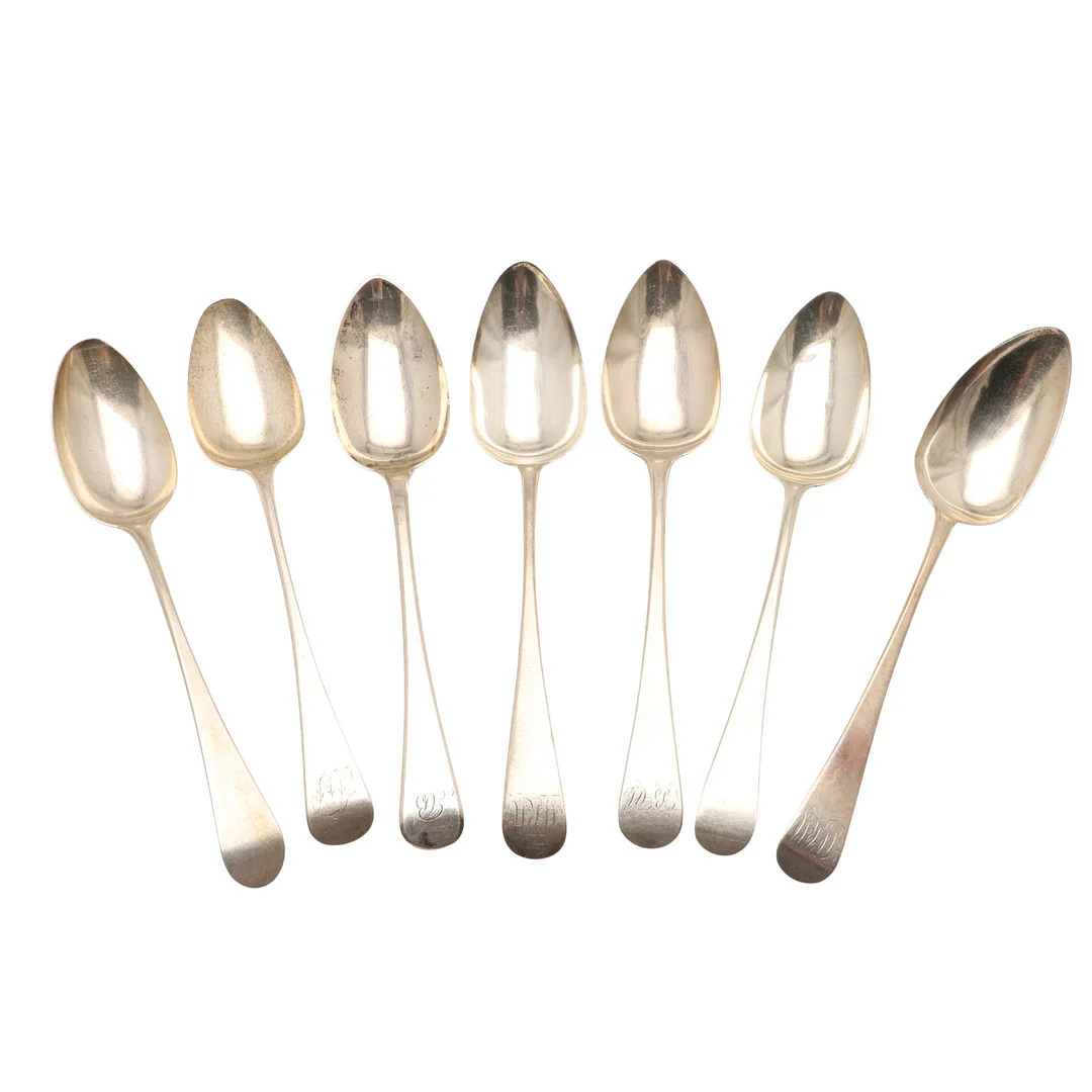 SEVEN GEORGE III OLD ENGLISH PATTERN SILVER SERVING SPOONS. — Silver — Lawrences Auctioneers