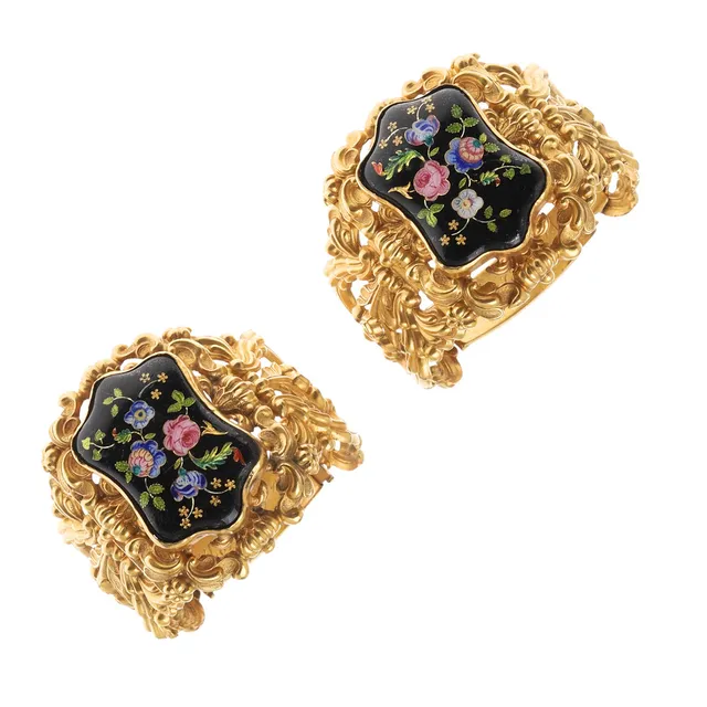 A PAIR OF 19TH CENTURY ENAMEL AND GILT BRACELETS.