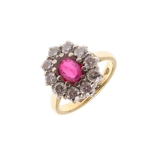 A RUBY AND DIAMOND CLUSTER RING.