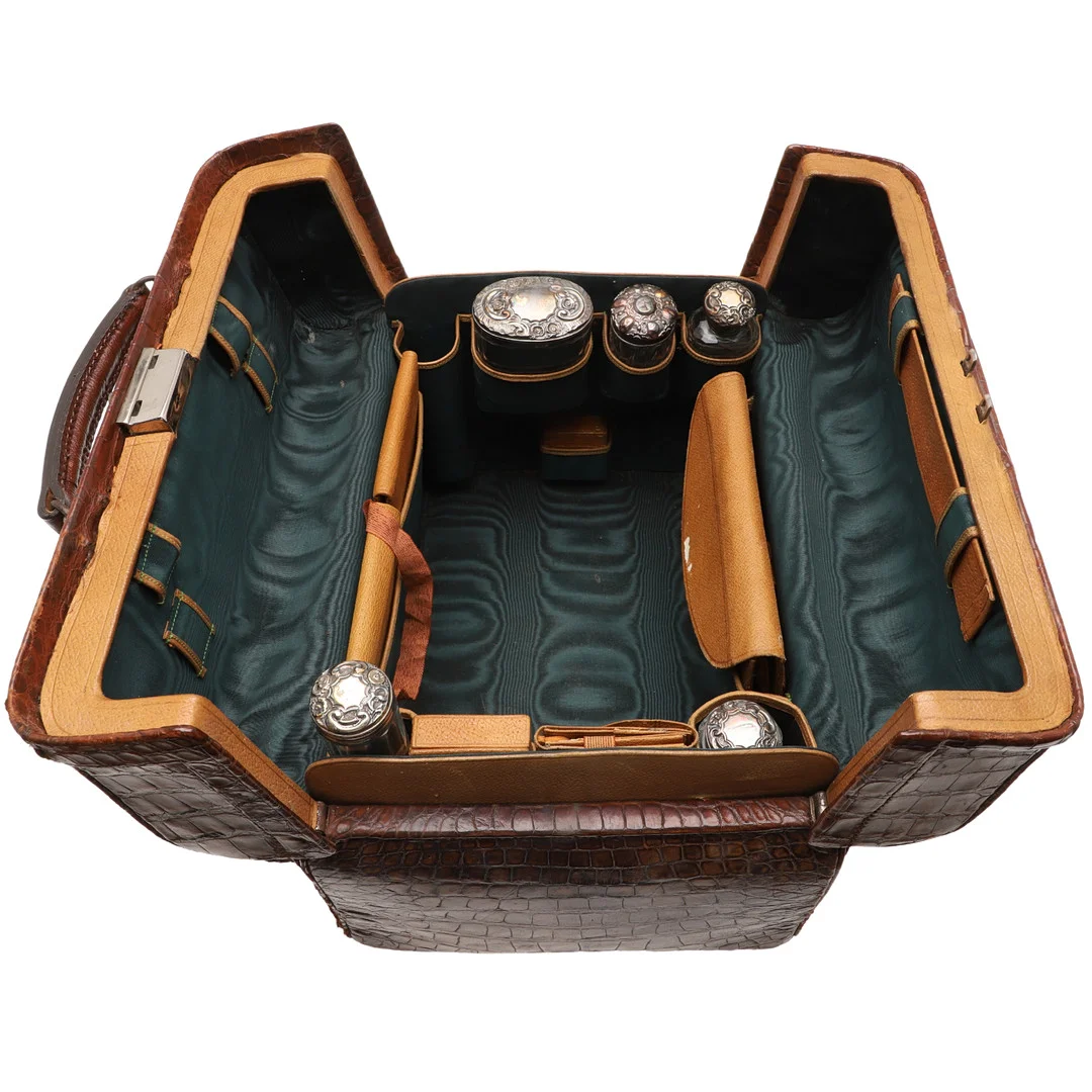 A LATE 19TH/ EARLY 20TH CENTURY CROCODILE LEATHER DRESSING CASE. — Silver — Lawrences Auctioneers