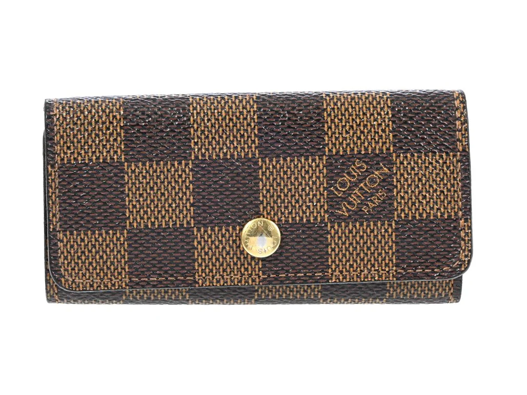 NYCKELHÅLLARE, LOUIS VUITTON, Damier ebene, guldfärgade beslag, 10,5x5,5 cm, märkt CT0150, år 2000. — Accessoarer/Nyckelringar — Kaplans