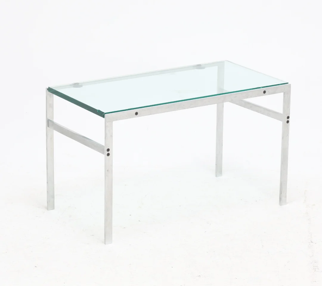 Fabritius Kastholm: Coffee table with brushed steel frame. Top made of strong transparent glass. — Furniture/Coffee tables, occasional tables — Lauritz
