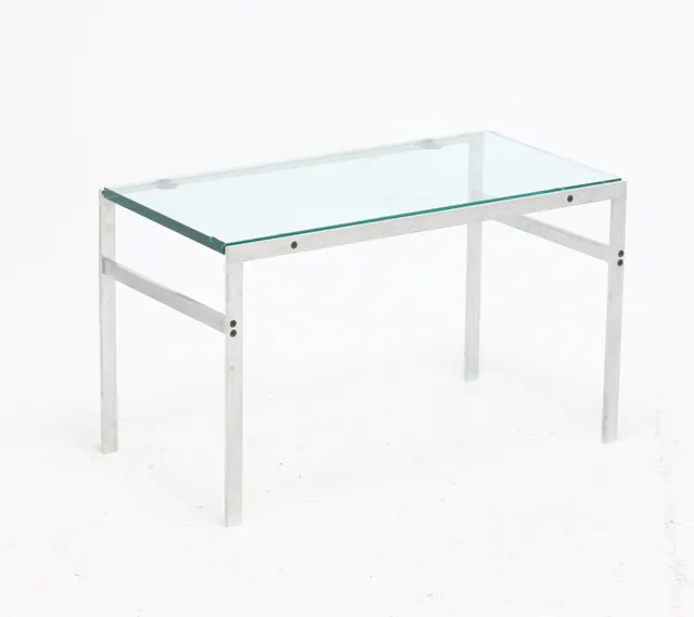 Fabritius Kastholm: Coffee table with brushed steel frame. Top made of strong transparent glass.