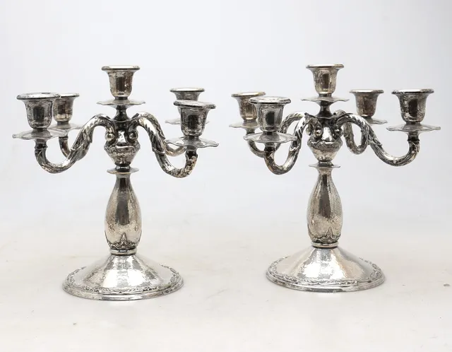 Pair of “martelé” silver candelabra, mid 20th Century.