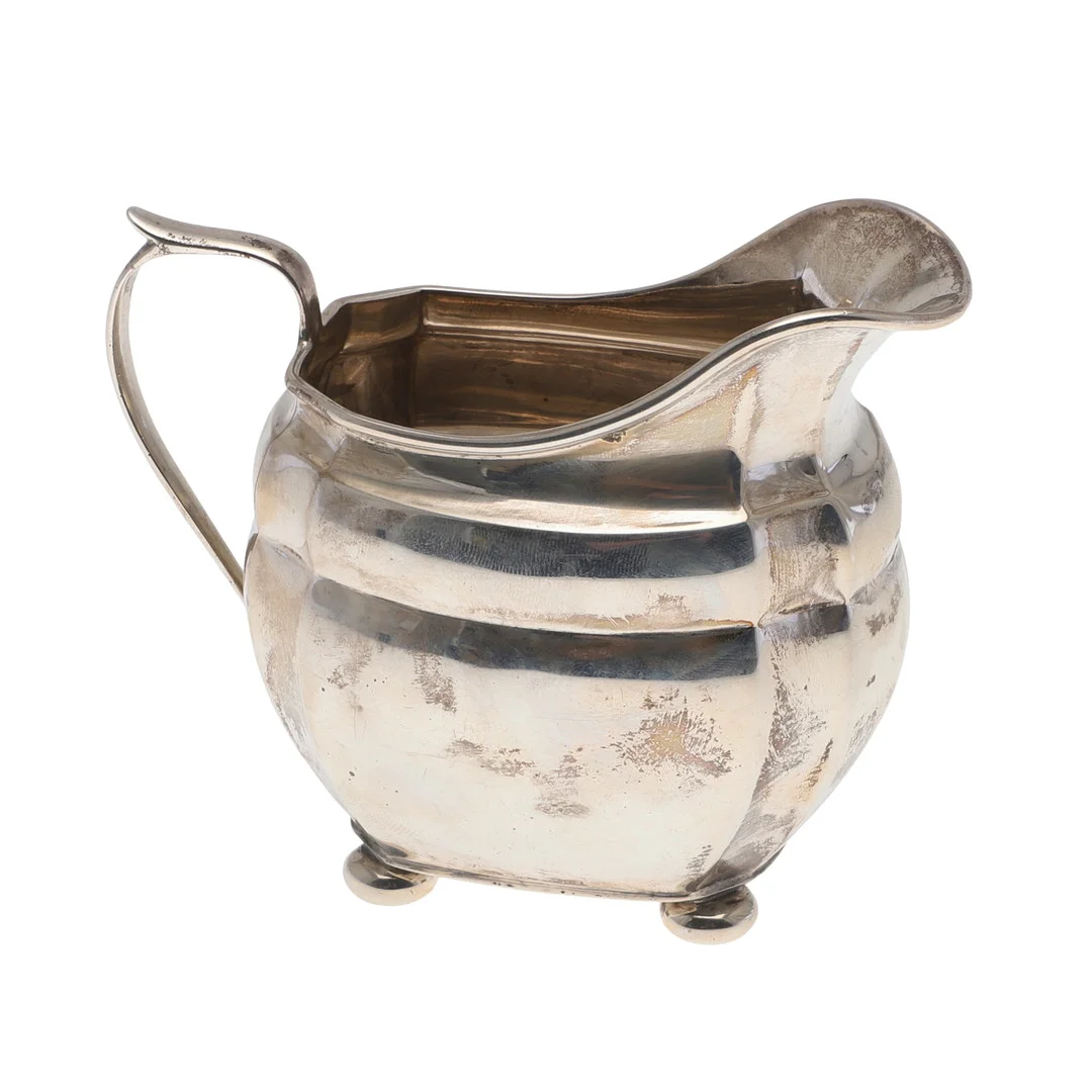 AN EARLY 20TH CENTURY SILVER MILK JUG. — Silver — Lawrences Auctioneers