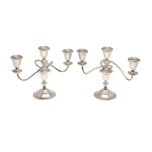 A PAIR OF GEORGE II STYLE WEIGHTED SILVER THREE LIGHT CANDELABRA.