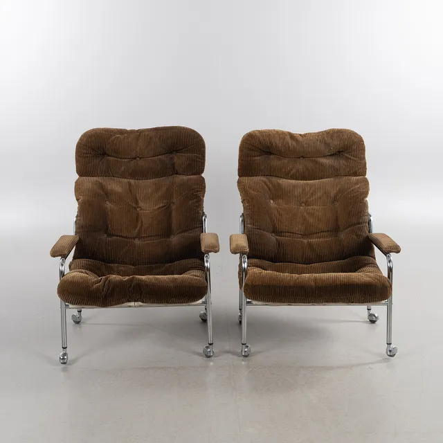 BO EIGERT. Fåtöljer, 1 par, "Stålbo", Hova, 1960-/70-tal, stommar i förkromad metall, underspänning i canvas, dynor klädda med manschestertyg.