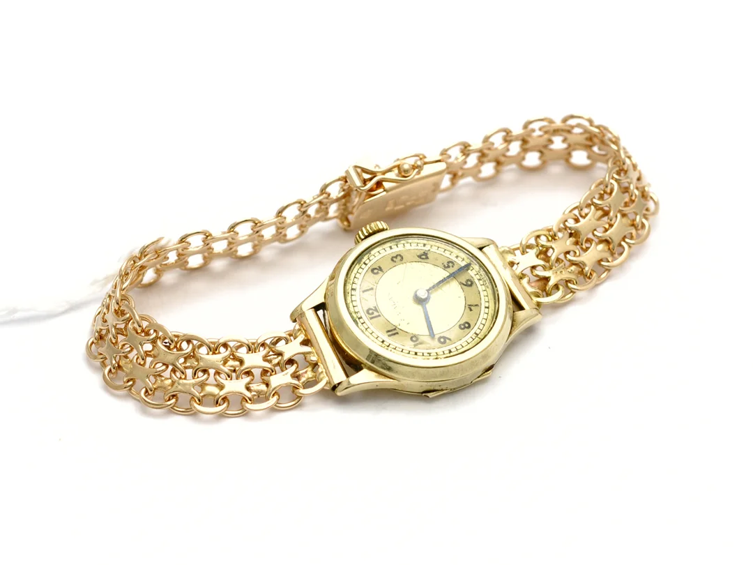 Svalan damur 14K, manuellt går ej, repigt plastglas, armband X-länk 18K brv.23,1g — Klockor/Svalan — Kaplans