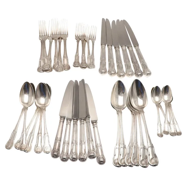 A GEORGE III AND LATER SILVER KINGS HOURGLASS PATTERN MATCHED FLATWARE SET.