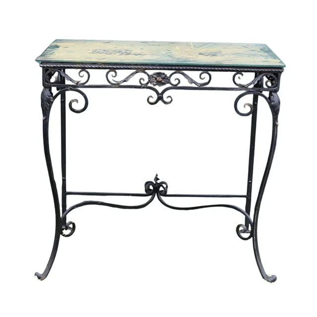 A WROUGHT IRON GLASS TOPPED PATIO TABLE. — Garden — Lawrences Auctioneers