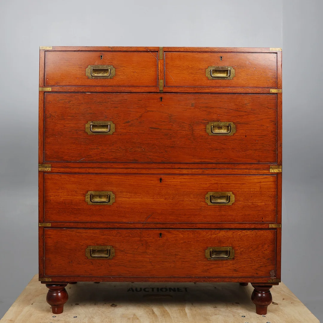 LATE VICTORIAN ARMY & NAVY TEAK AND BRASS BOUND CAMPAIGN CHEST. — Chests of drawers — Young's Auctions