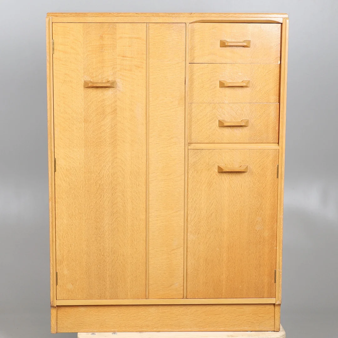 E GOMME FOR G PLAN. A GENTLEMAN'S PALE OAK COMPACTUM WARDROBE. — Chests of drawers — Lawrences Auctioneers
