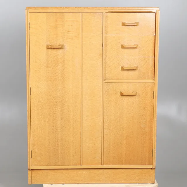 E GOMME FOR G PLAN. A GENTLEMAN'S PALE OAK COMPACTUM WARDROBE.