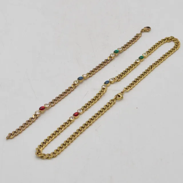 VINTAGE MODESCHMUCK SET, VERGOLDETES ARMBAND UND HALSKETTE, SPÄTES 20. JAHRHUNDERT.