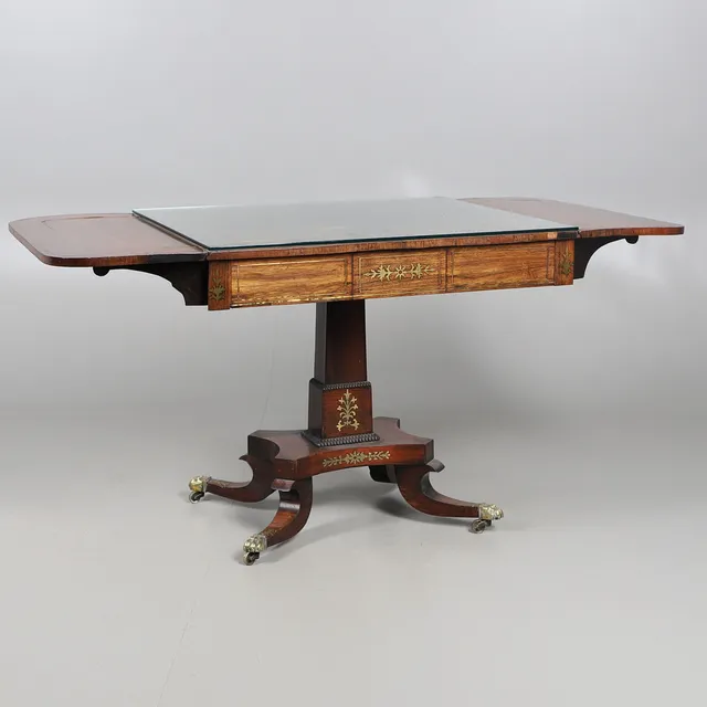 A REGENCY ROSEWOOD AND BRASS INLAID SOFA TABLE.