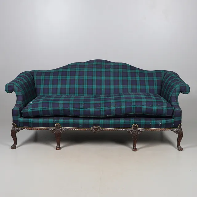 A CAMEL BACK SETTEE.
