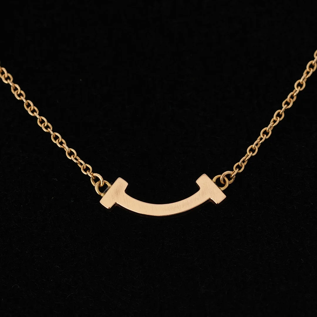 TIFFANY & CO. 'Smile' halskæde af 18 kt guld (mini). — Necklace — Palsgaard Kunstauktioner