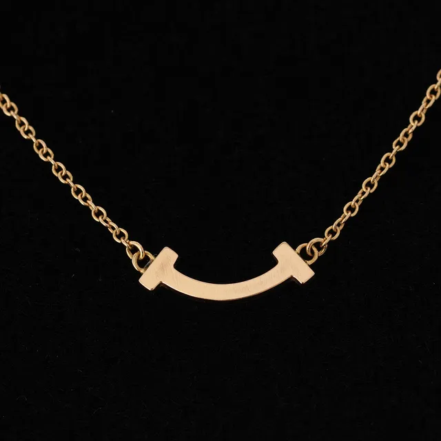 TIFFANY & CO. 'Smile' halskæde af 18 kt guld (mini).