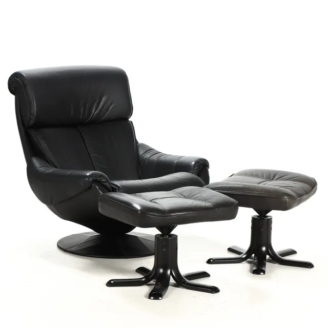 Armchair with two Stouby stools, upholstered in black leather. (3)