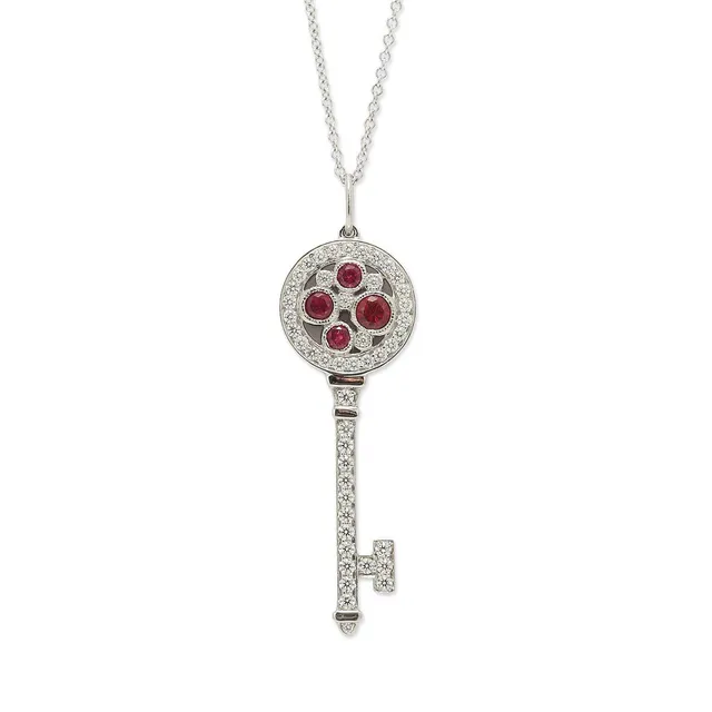 A “Cobblestone Key” pendant set with four circular-cut rubies and numerous brilliant-cut diamonds weighing a total of app. 0.53 ct, mounted in platinum. Colour: G-H. Clarity: VVS-VS. Accompanied by a necklace of 18k white gold. Weight in total app. 7 g. Pendant incl. eye-let L. 4.1 cm. L. 60 cm. (2)