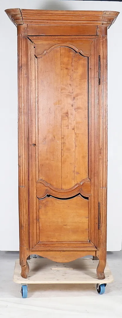 A FRENCH WALNUT ARMOIRE.