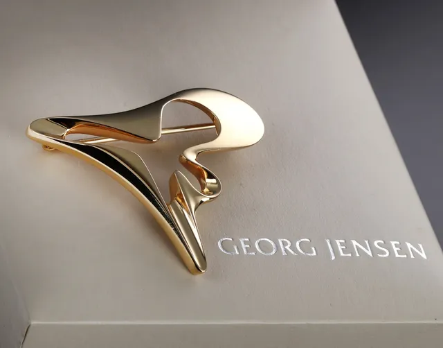 Henning Koppel for Georg Jensen. 'Splash' broche af 18 kt. guld, dess. 1324