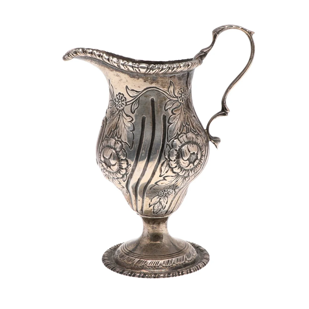 AN EDWARDIAN SILVER CREAM JUG. — Silver — Lawrences Auctioneers
