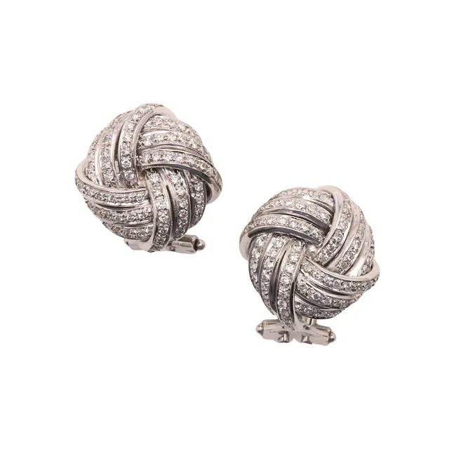 A PAIR OF DIAMOND EARRINGS.