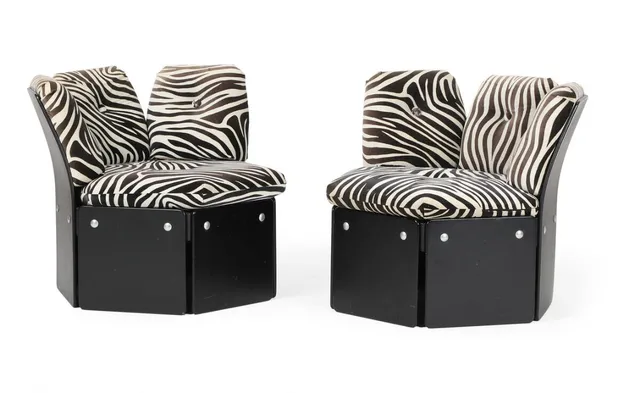 “Sixtus”. Pair of modular chairs in black lacquered plywood, upholstered in zebra fabric. Manufactured and marked by C. F. Christensen. (2)