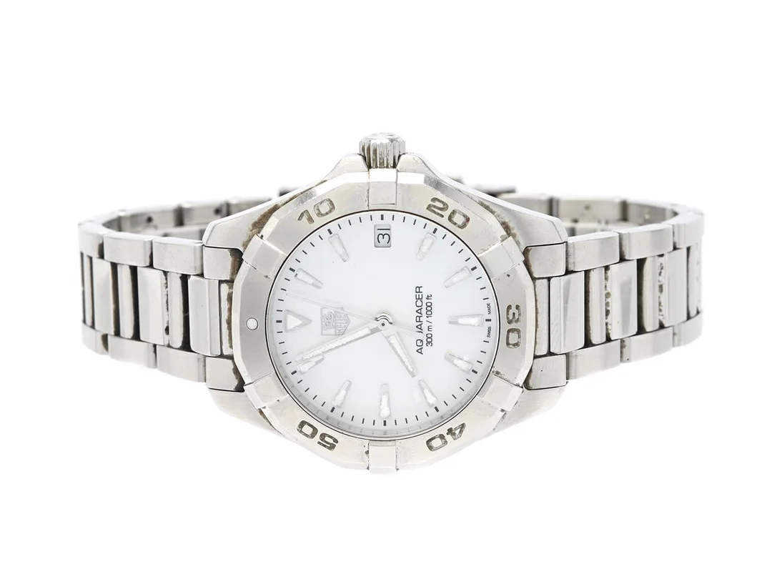 TAG HEUER, Aquaracer (300 m /1000 ft), Serie nr. RMT7082, Ref nr. WAY1312.BA0915, Boett nr. WAY1312, damur, 32 mm, stål, quartz, safirglas, datum, pärlemorurtavla (skadad), originallänk, viklås, Ref nr. FAA072/Y-F9/3189, ca 2012, box, ytterkartong. — Klockor/Tag Heuer — Kaplans