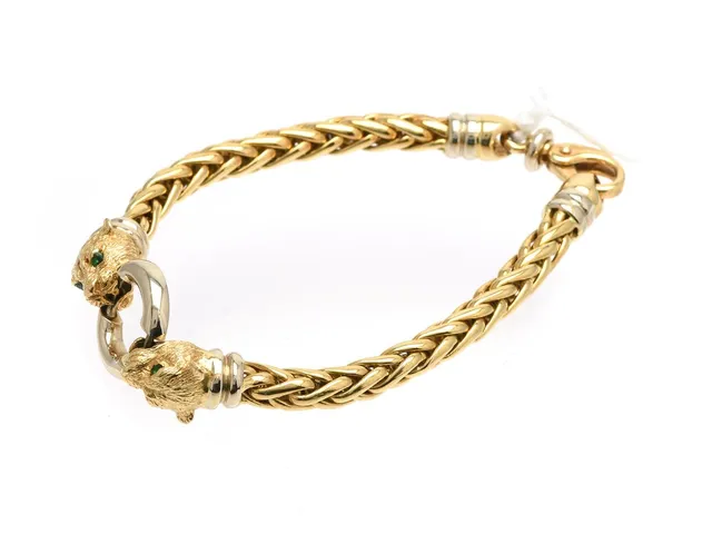 Armband 18K tvåfärgad 35,7g längd: 20,5cm med gröna stenar och karbinhake
