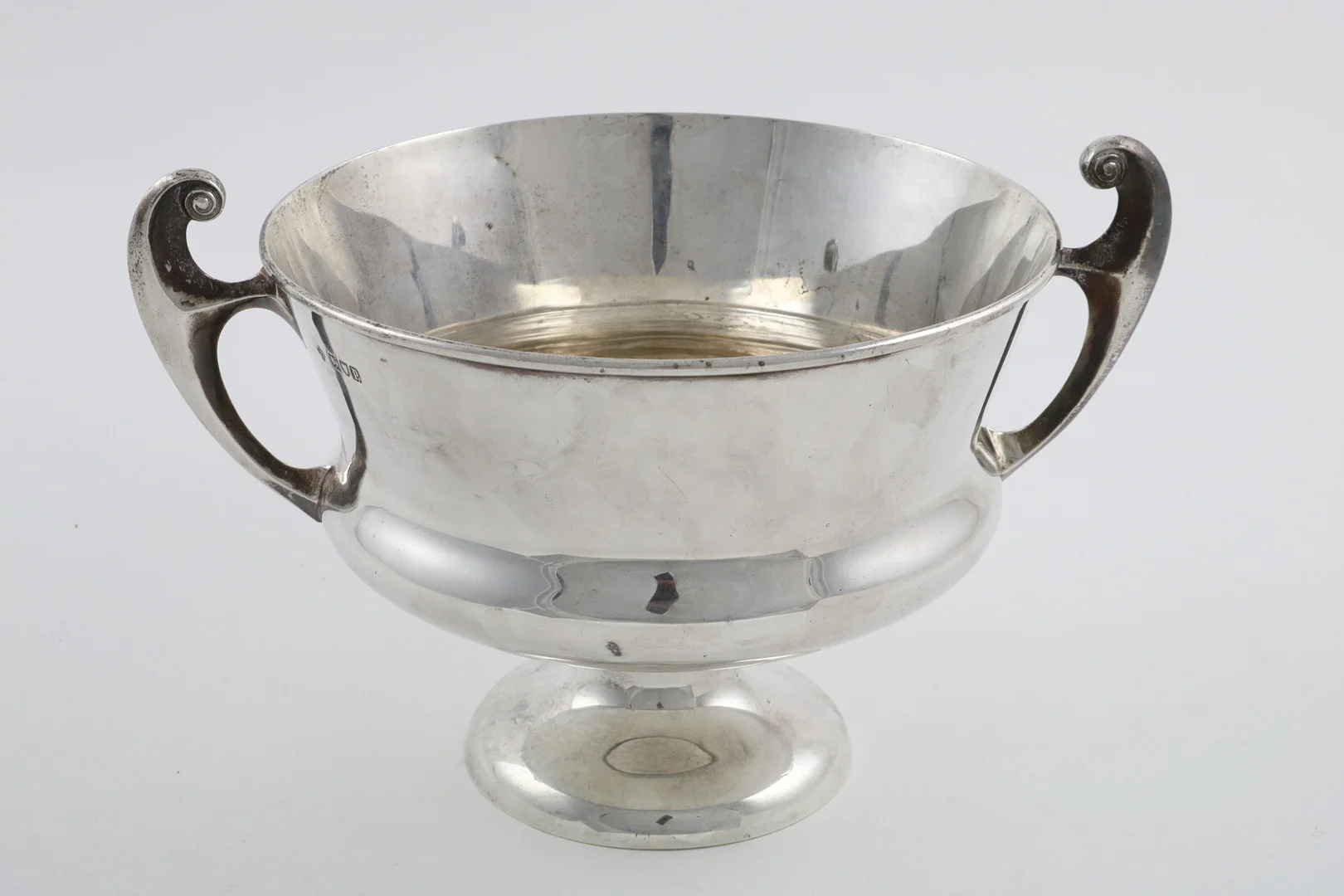 AN EDWARDIAN ART NOUVEAU TWO-HANDLED BOWL. — Silver — Lawrences Auctioneers