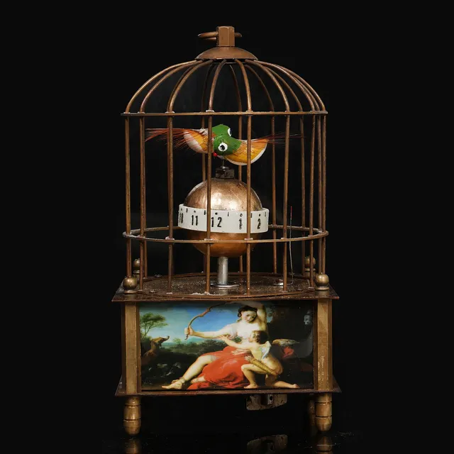 A CLOCKWORK AUTOMATON BIRD CAGE CLOCK.