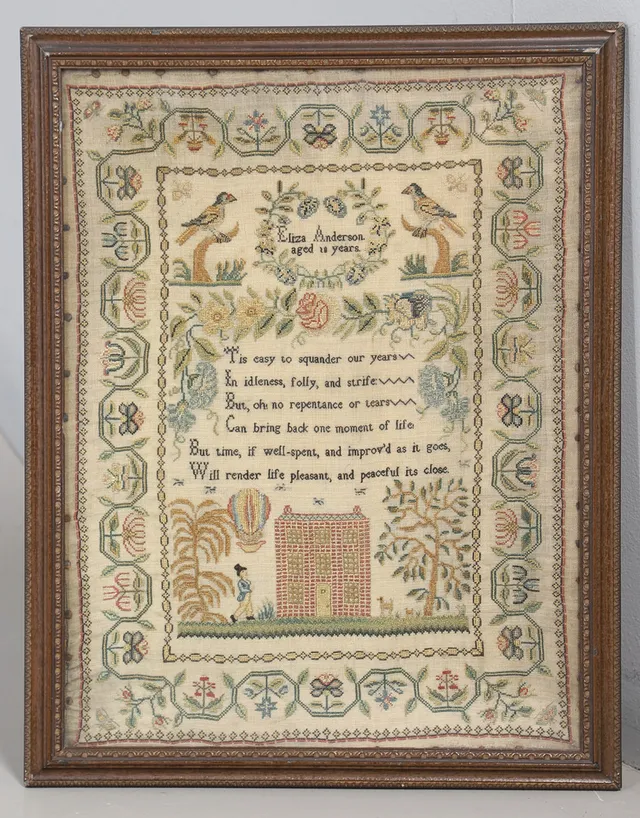 A GEORGE III NEEDLEWORK PICTORIAL SAMPLER.