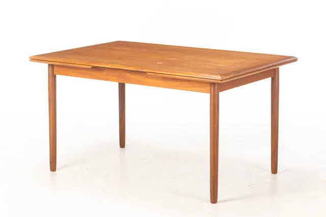 Danish furniture manufacturer. Teak dining table with extension. 1950s/60s.