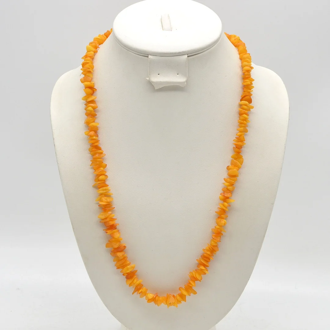 ENDLOSCOLLIER AUS BUTTERSCOTCH-BERNSTEIN, POLIERTE PERLEN, CA. 65CM, 20. JAHRHUNDERT. — Necklace — Kunst- und Auktionshaus Kleinhenz