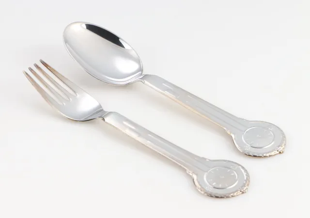 Carl M. Cohr. 'Clock' children's cutlery set made of silver (2)
