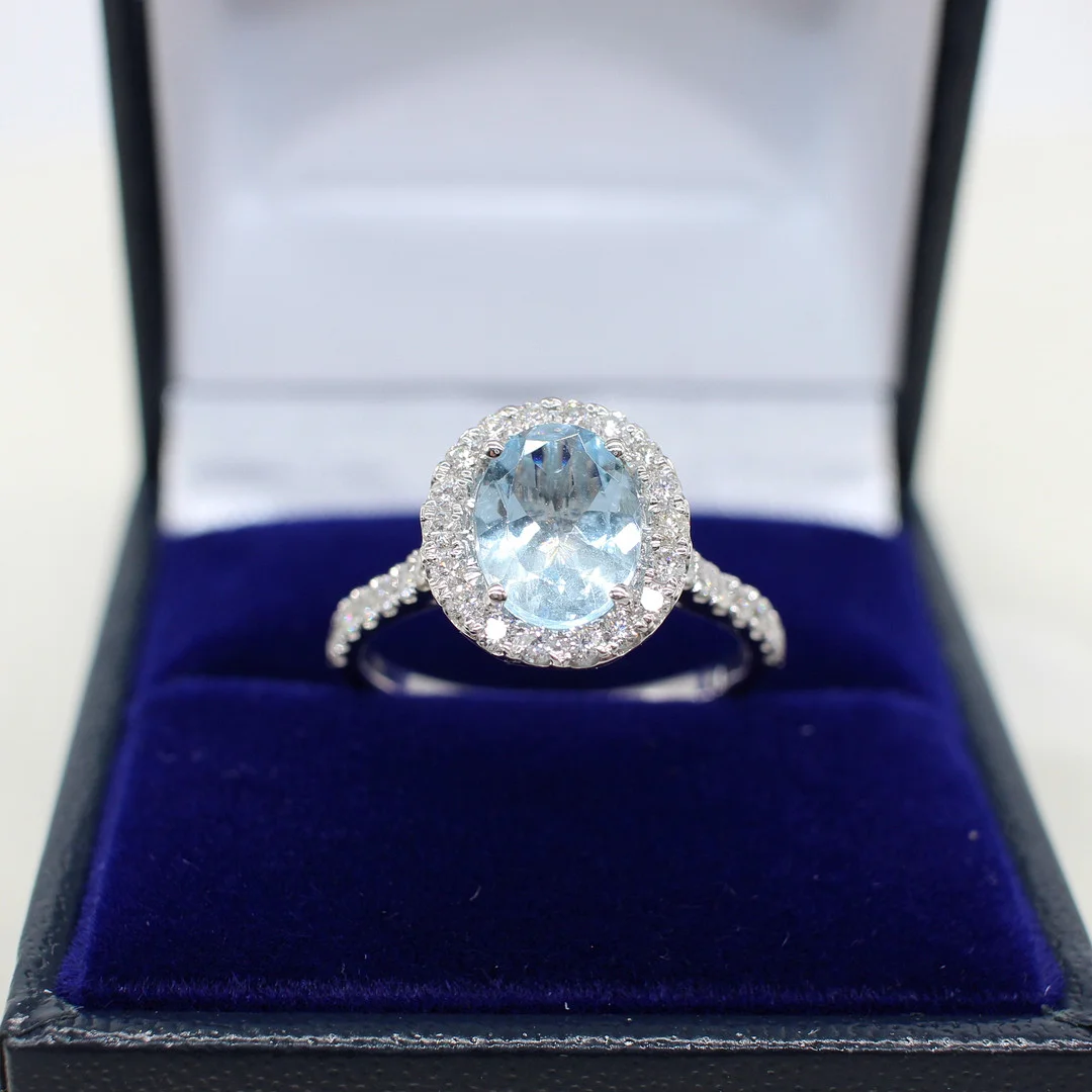 AQUAMARINE & DIAMOND HALO RING. — Rings — Rumsey’s Auctioneers