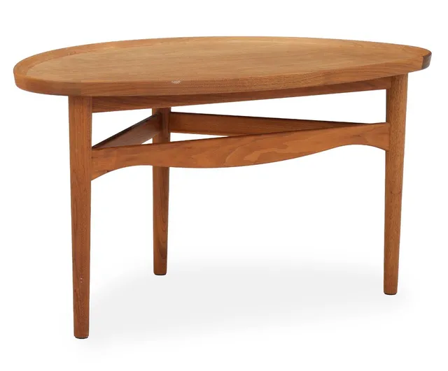 “Eye Table”. Teak wood coffee table. Top with raised edge. Model 4850. Designed 1946. Manufactured and marked by House of Finn Juhl. H. 50 cm. L. 90 cm. W. 55 cm.