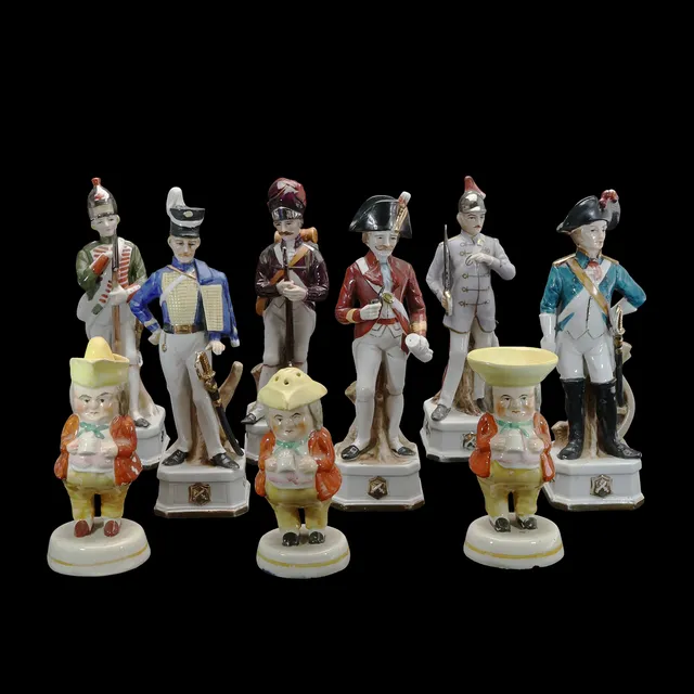 3 STAFFORDSHIRE "TOBY" CONDIMENTS, AND 6 PORCELAIN SOLDIERS. (9).