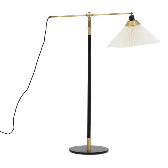 “Teleskop”. Adjustable floor lamp of brass and black-lacquered metal. Pleated acrylic shade. Model 349. Manufactured by Le Klint. H. max. c. 160 cm.