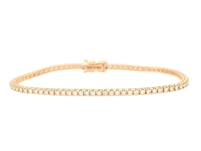 TENNISARMBAND, 18K guld, 80 briljantslipade diamanter ca 1,35 ctv, ca TW-TCr/VS, längd 17,5 cm, vikt 9,8 g.