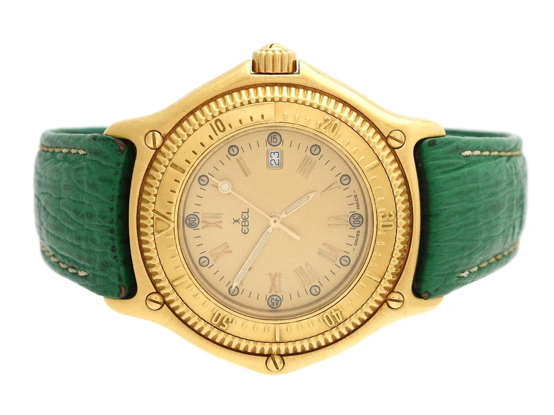 EBEL, Discovery Divers 200m, Cal 83, Serie nr. 407, Ref nr. 883913, herrur, 38 mm, 18K guld, quartz, safirglas, datum, utbytta visare (Luminova), integrerat läderband, viklås i 18K guld, cert, juli 1988, påse. — Klockor/Ebel — Kaplans
