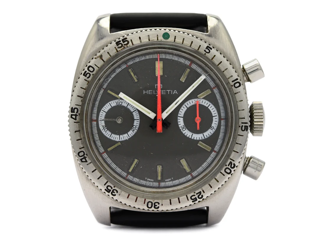 HELVETIA, kronograf, herrur, 37 mm, Cal Valjoux 7734, Boett nr. 63-16-01, stål, manuell, plexiglas, läderband, ca 1970. — Klockor/Helvetia — Kaplans
