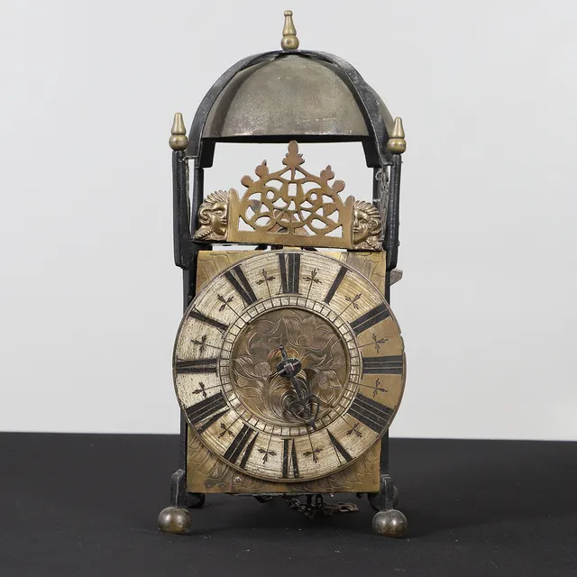 AN EARLY 19TH CENTURY LANTERN CLOCK AND BRACKET.