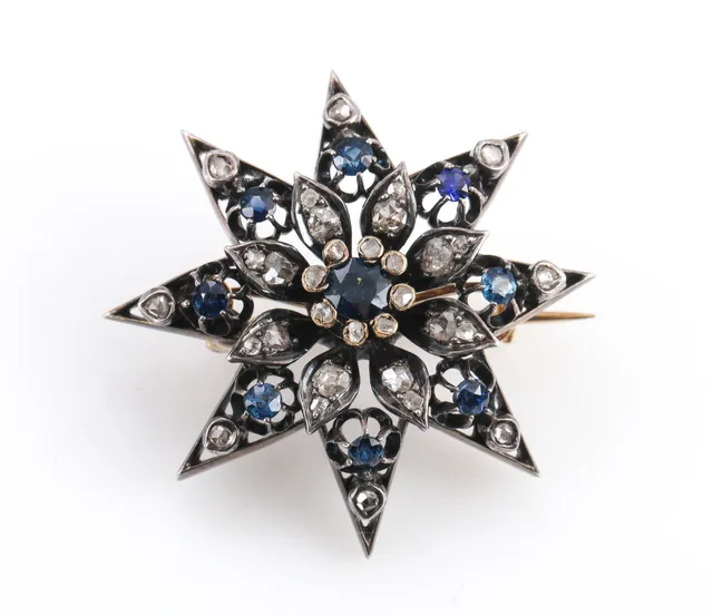 Vintage sapphire and diamond star brooch in 14k gold and silver
