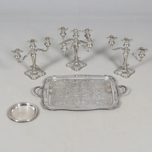 A PLATED TWO HANDLED TEA TRAY, A DISH & A TRIO OF CANDELABRA.