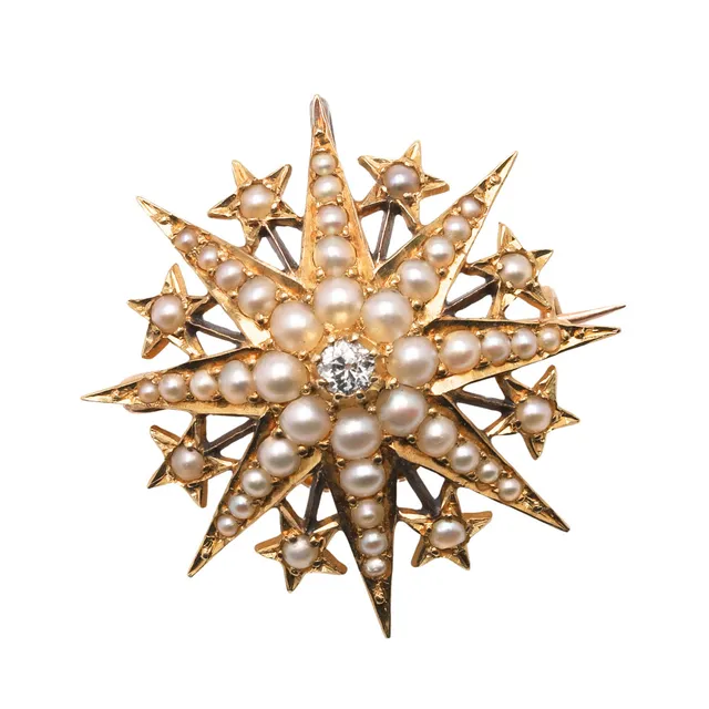 A VICTORIAN PEARL AND DIAMOND STARBURST BROOCH.